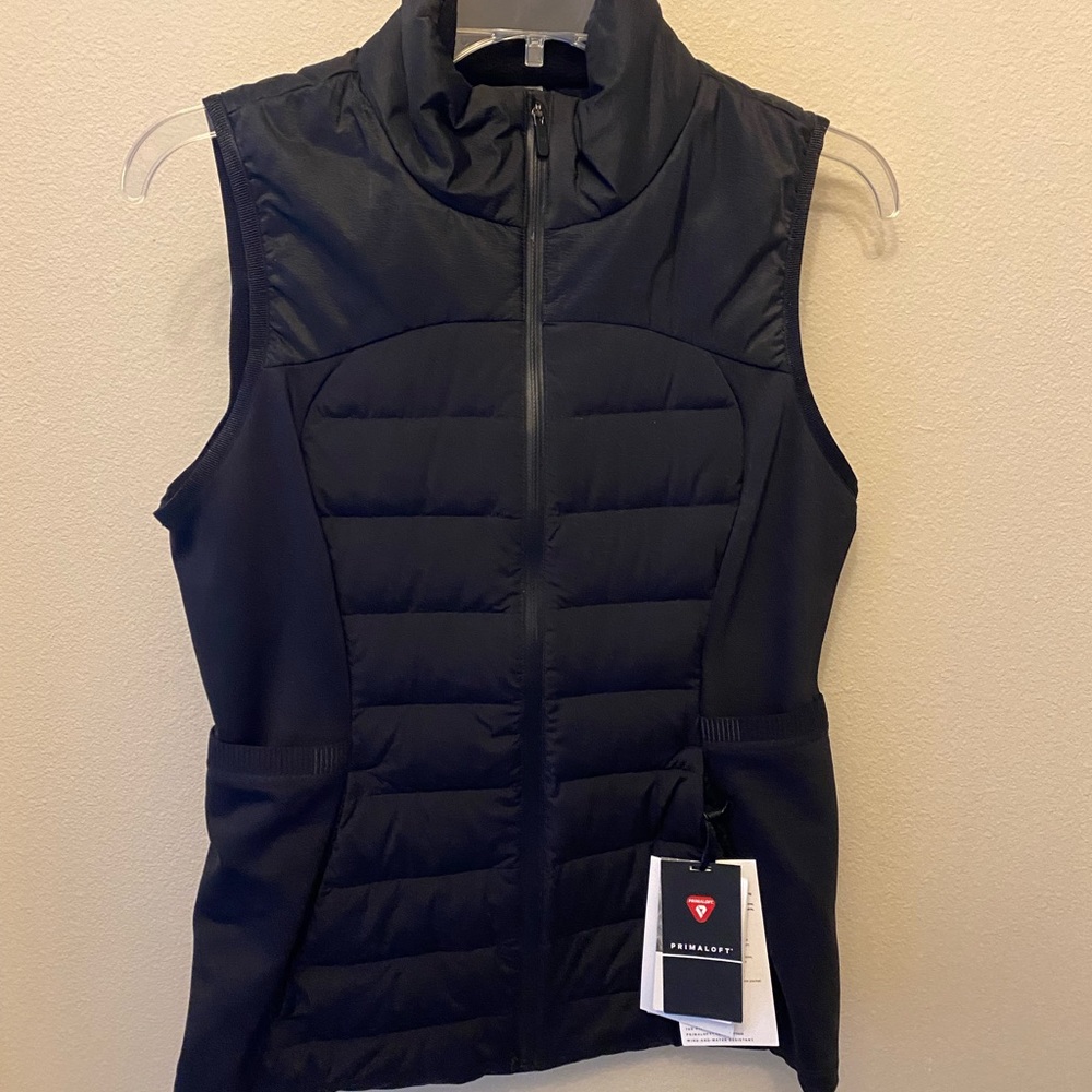 Black Lululemon zip up vest. Size 8. Never been worn, perfect condition! Tags on